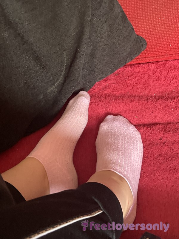 Baby Pink Trainer Socks Relaxing On Red Sofa
