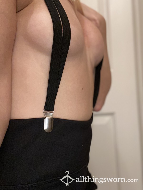 Black Suspenders; Pulled Tight Against Bare Breasts...
