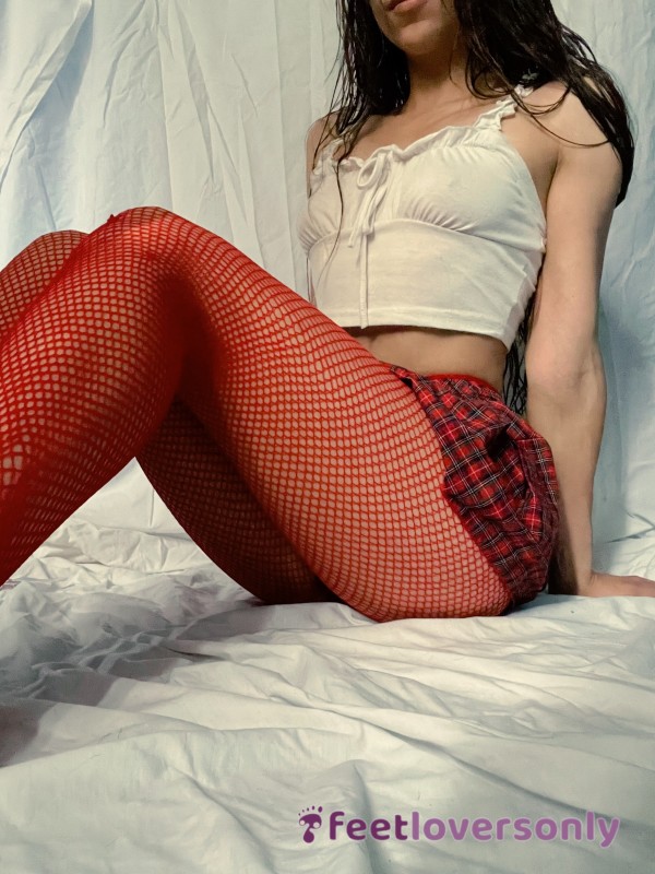 Fit Girl In Sexy School Girl Outfit With Red Fishnet Stockings And White Pedicure