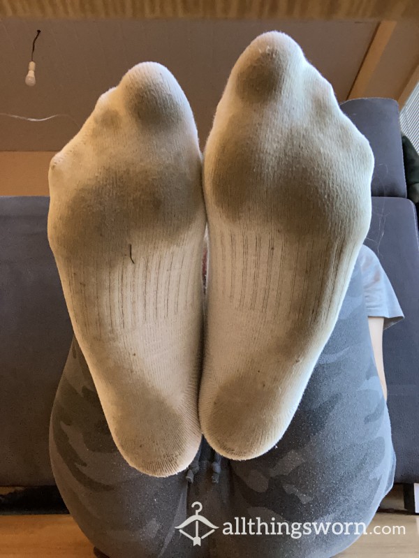 Extremely Dirty And Sweaty Nike Socks With Foot Prints