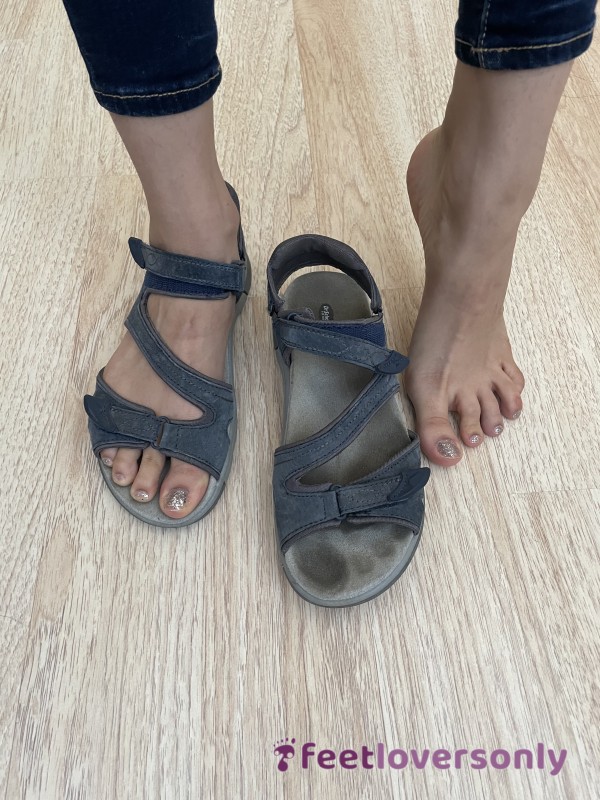 Well-worn Blue Sandals With Foot Prints
