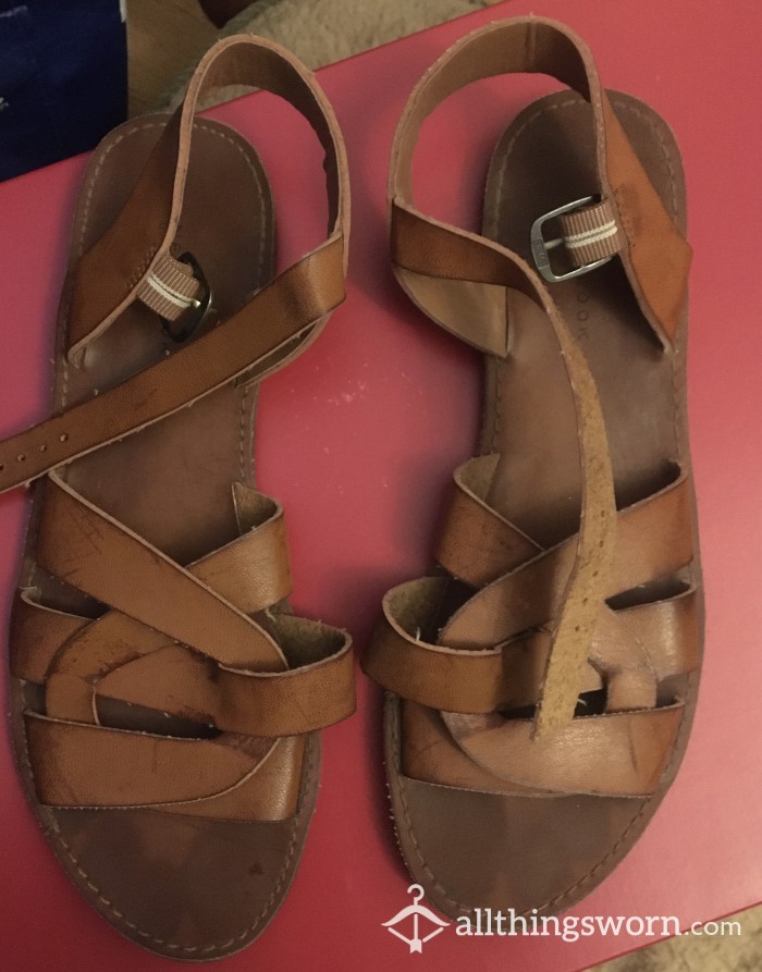 Well Worn Sandals With Sweat Stains