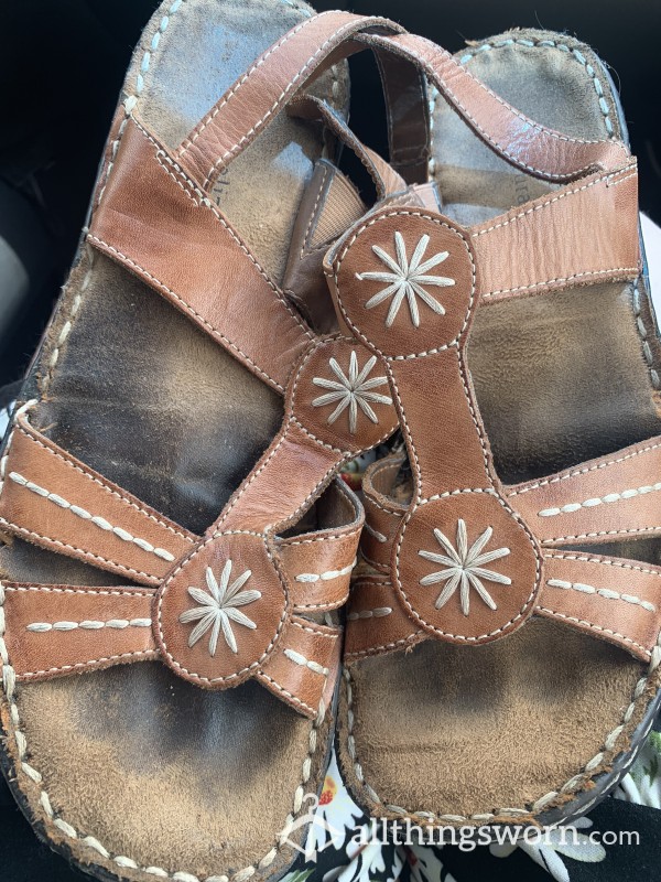 Well Worn Sandals With Toe Marks